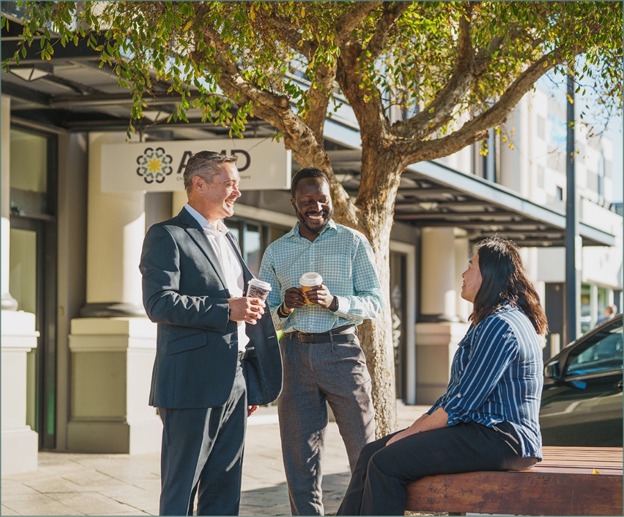 Tim talking with staff on break in front of the bunbury amd office